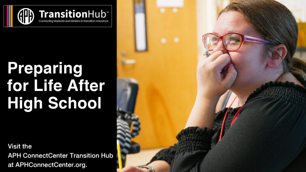 Girl sitting at desk with hand on face smiling. Preparing for life after high school.